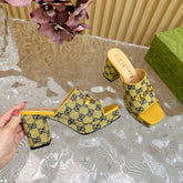 HORSEBIT SLIDE SANDAL IN TUSCANY YELLOW MONOGRAM CANVAS AND SHEEPSKIN LINING